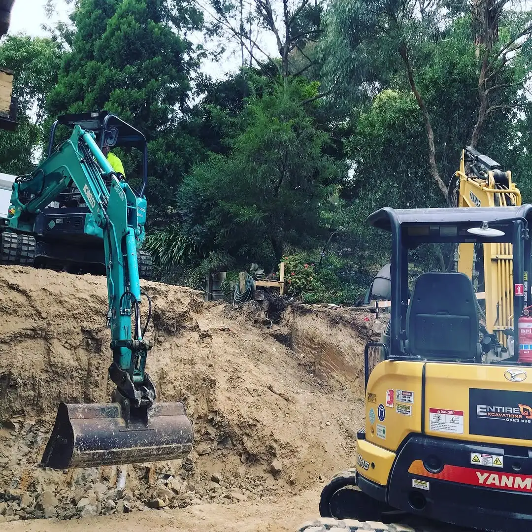 Two excavators working the Healesville cut, an Entire Excavations machine in the foreground and a second up on the face