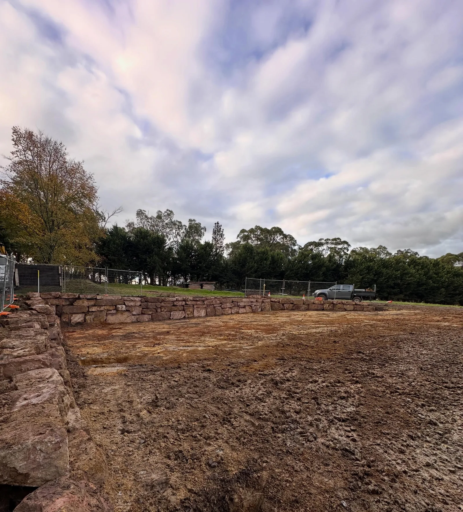 Completed 650 cubic metre site cut in Silvan with the finished mudstone rock retaining wall holding the new level