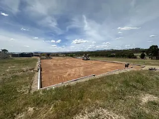 Entire Excavations rural site preparation with Posi-Track skid steer
