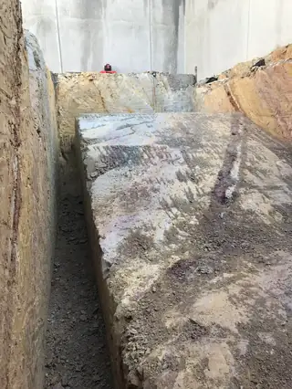 Cut rock face exposed during site excavation
